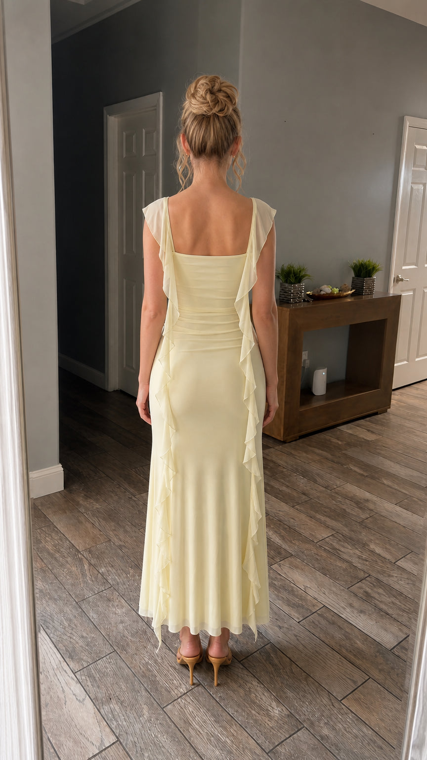 Back view of model wearing the yellow long dress