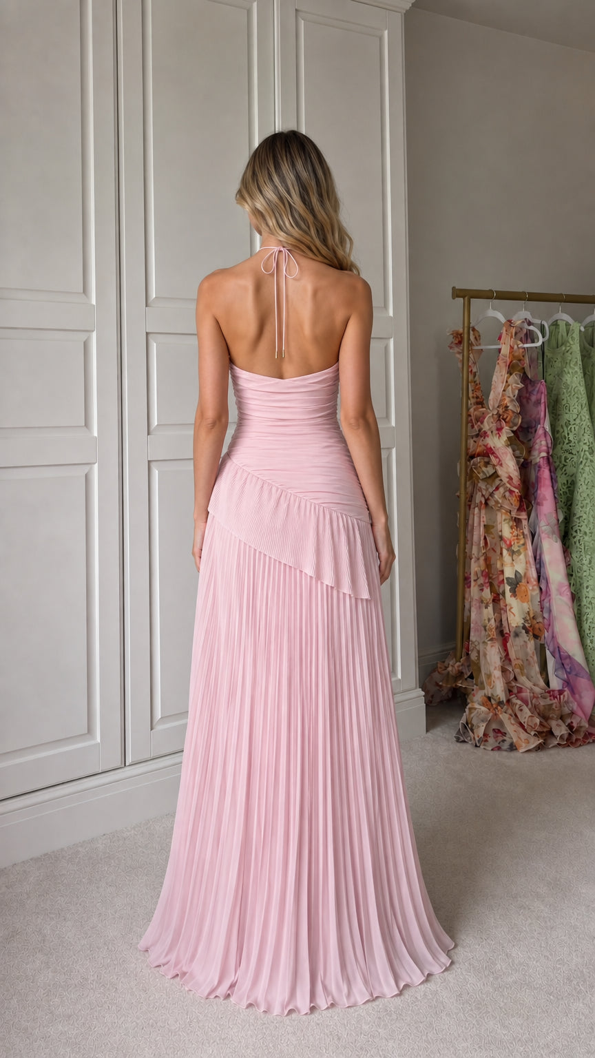 Back view showing halter tie straps on pink maxi dress