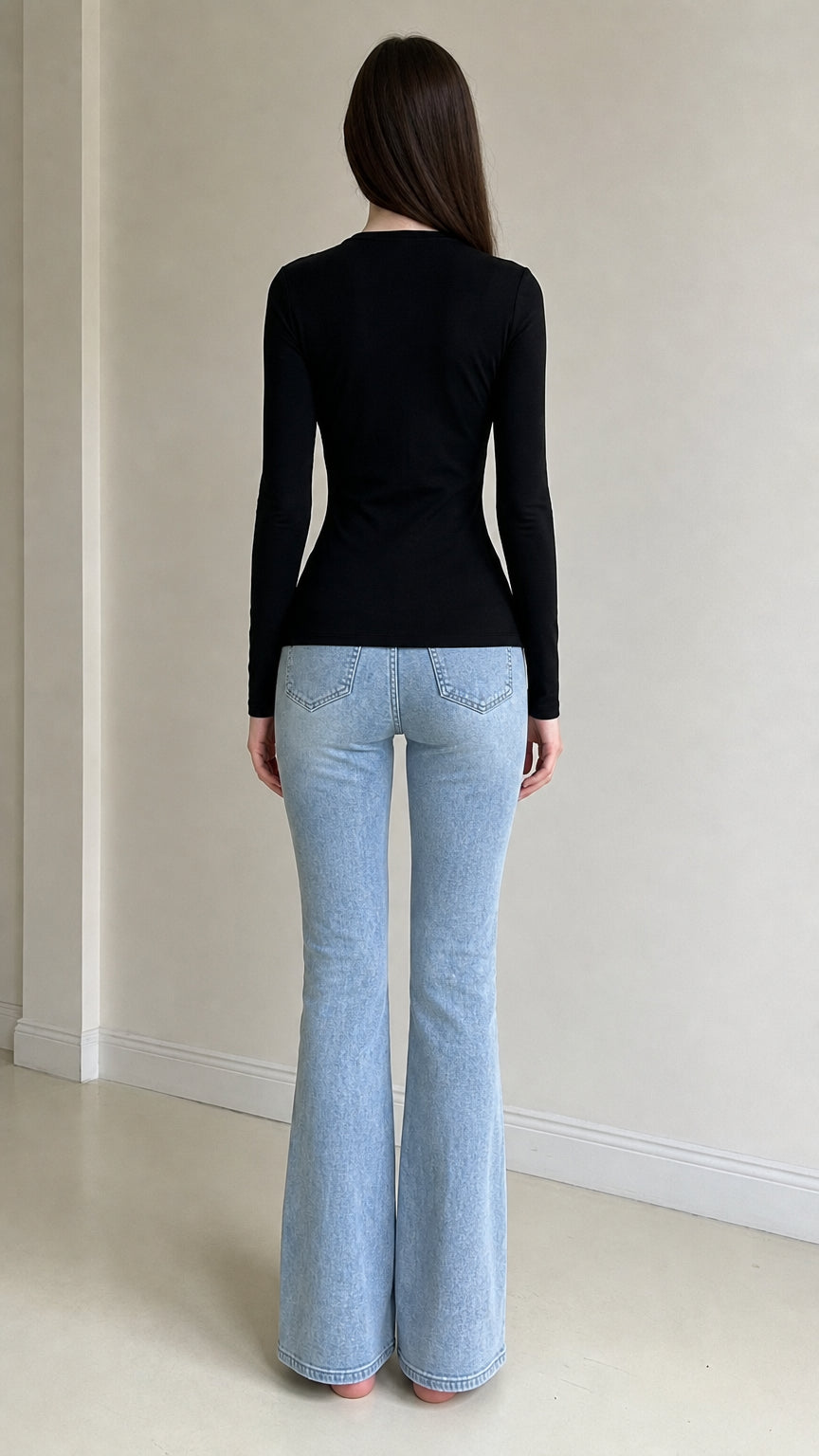 Back view of woman wearing black long sleeve top