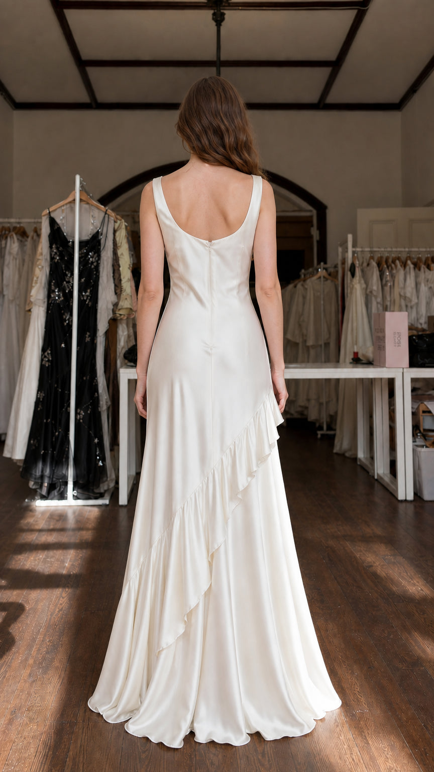 Model showing back view of Ivory satin maxi dress