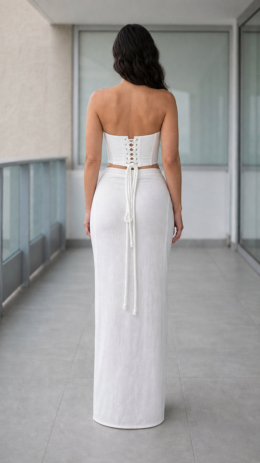 Back view showcasing lace-up corset detail on white matching set