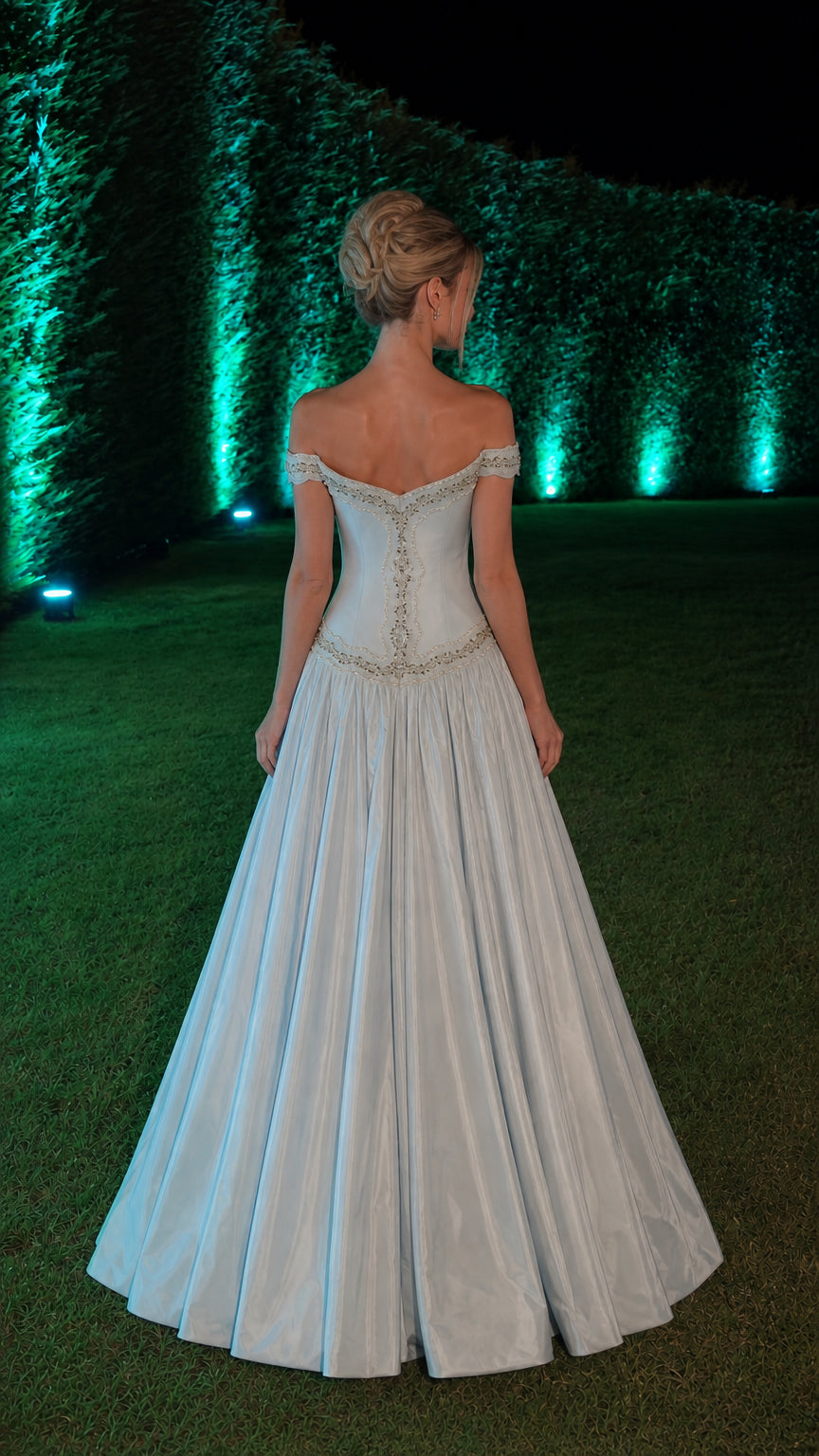 Back view of light blue ball gown showing corset-style back and skirt volume