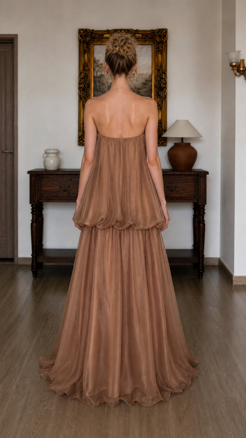 Back view of model in brown strapless maxi dress
