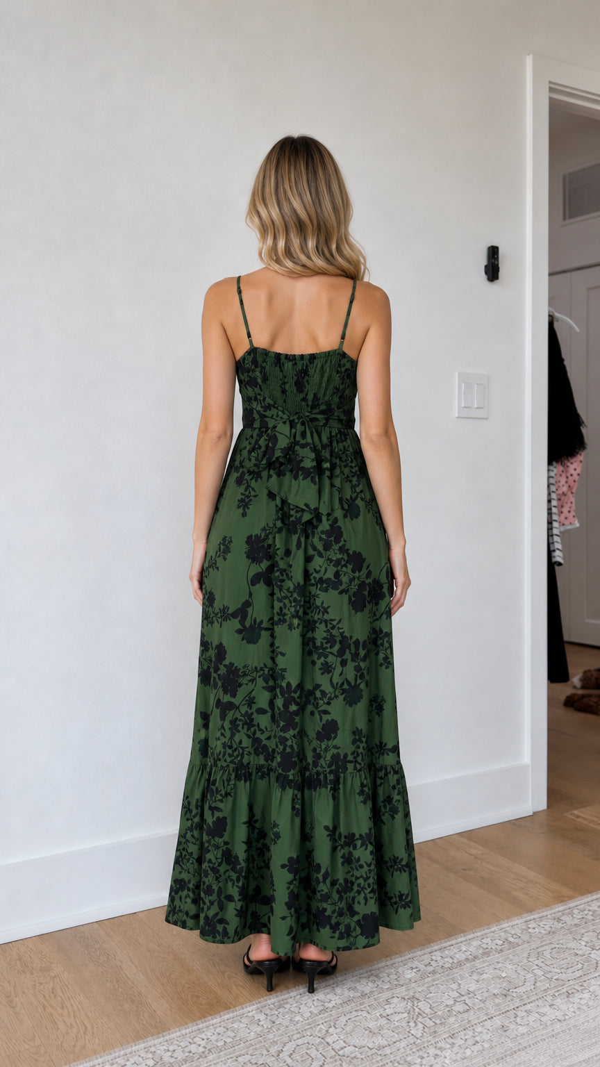 Back view of model wearing green floral maxi dress