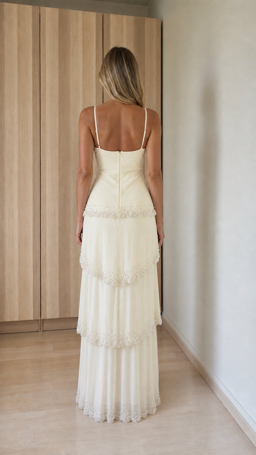 Back view of ivory tiered maxi dress