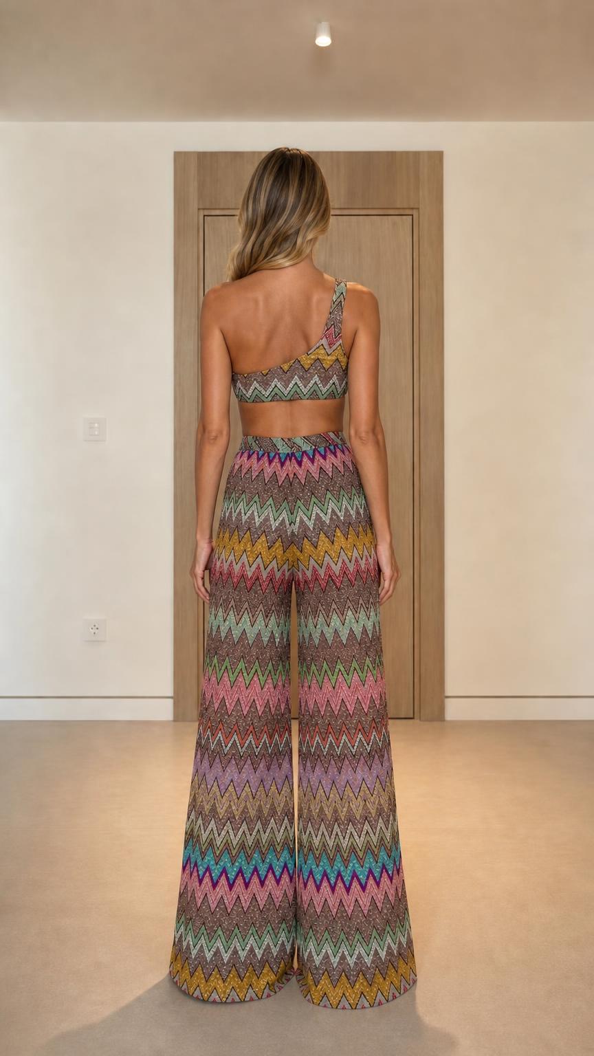Back view of model wearing multi-color chevron knit two-piece set