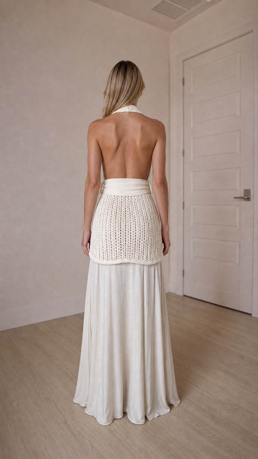Back view of ivory open back halter top and skirt