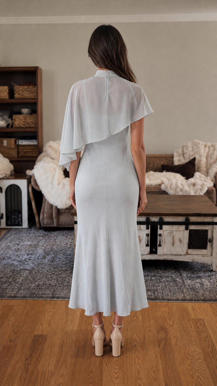 Back view of light blue cape midi dress
