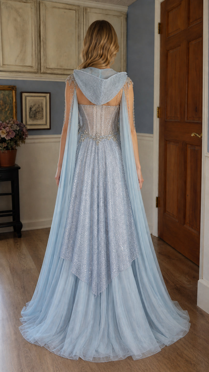 Back view showing hooded cape and train on light blue gown
