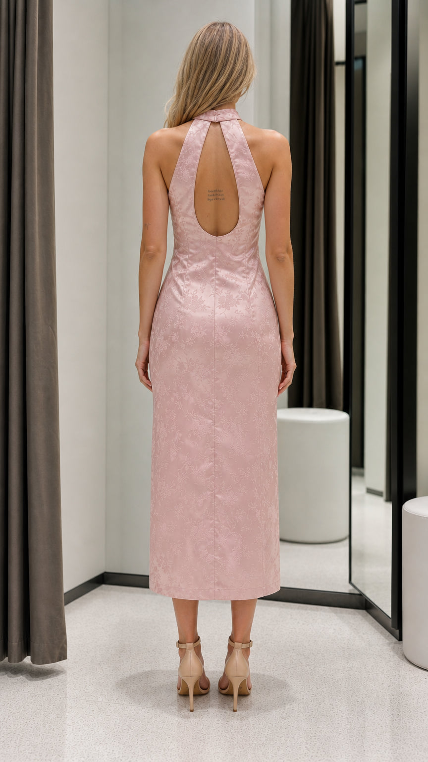 Back view of pink halter dress showing keyhole detail