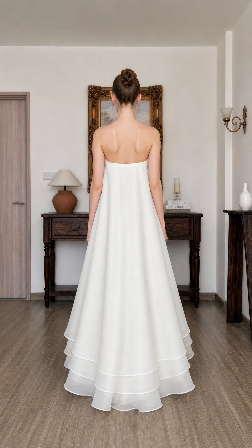 Back view of white strapless tiered long dress