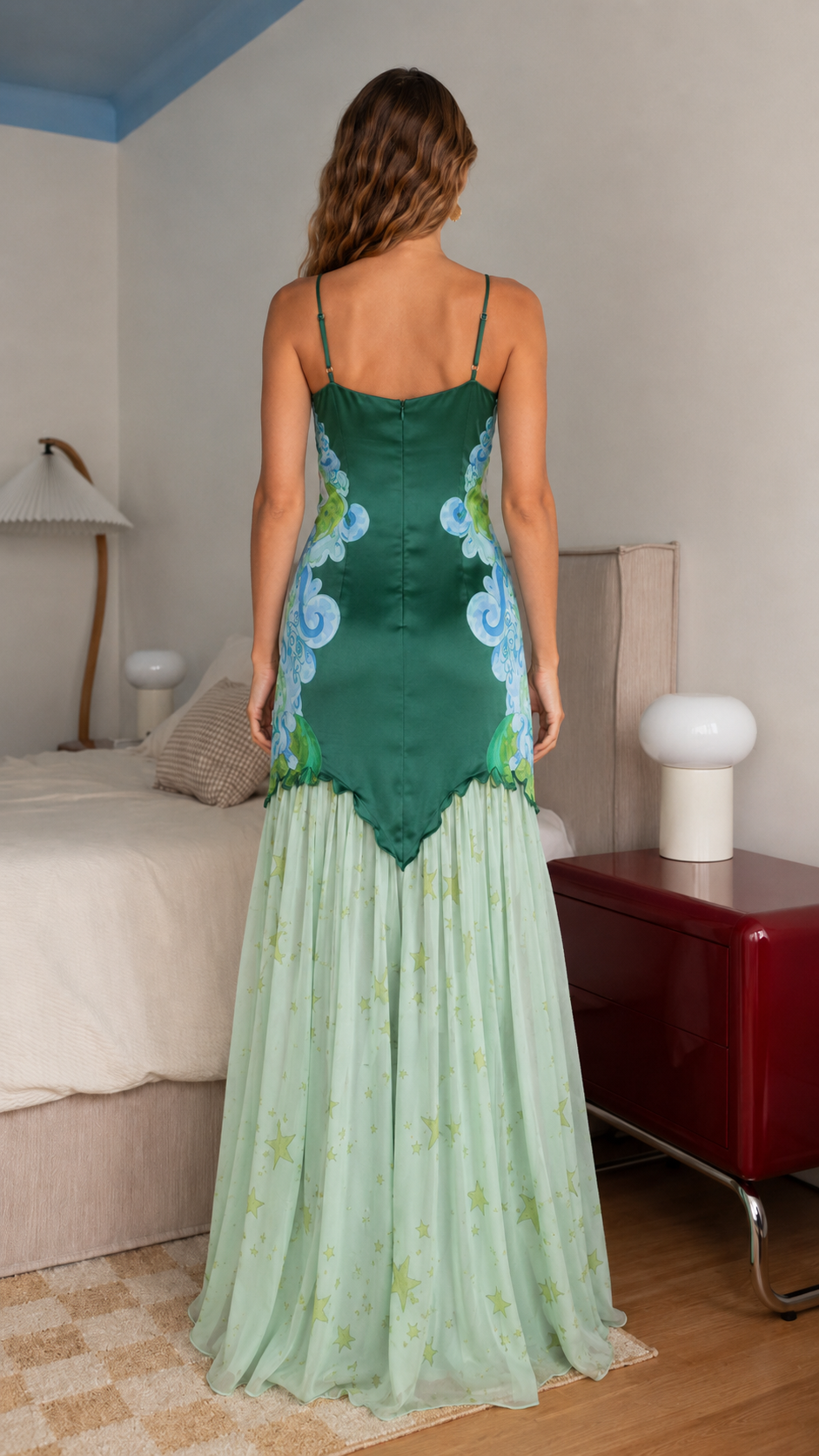 Back view of emerald mermaid maxi dress with slim straps and sheer flared hem