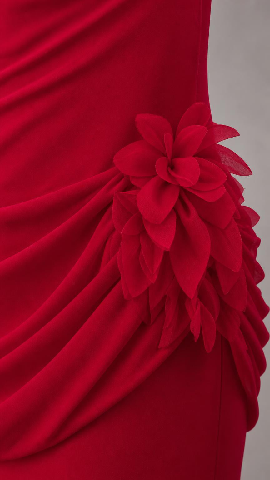 Close up of 3D fabric flower appliqués on draped red dress