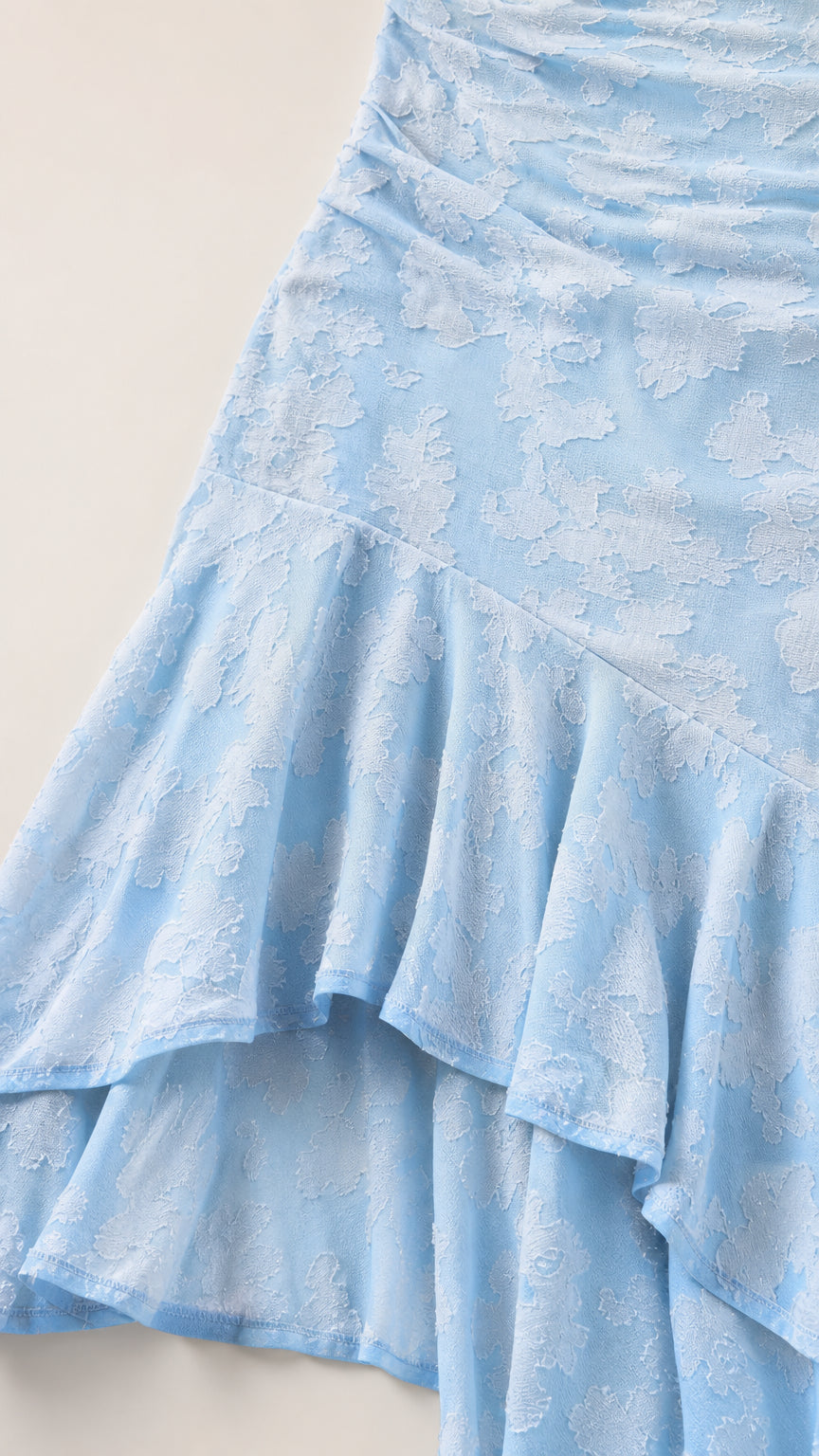 Close up of textured fabric and tiered ruffle hem