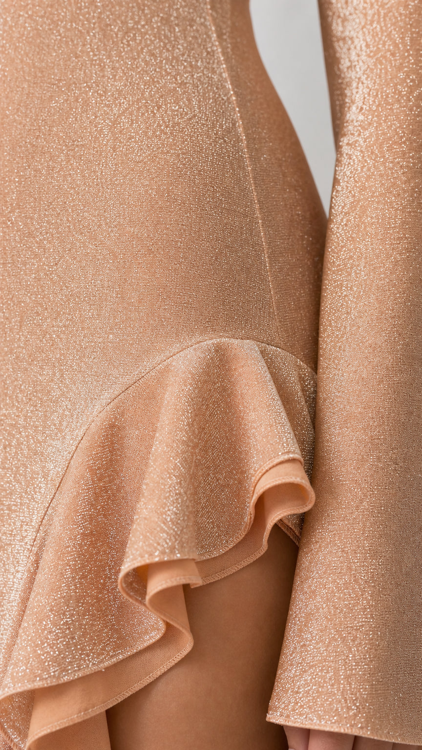 Close-up detail of fabric texture and side ruffle accent
