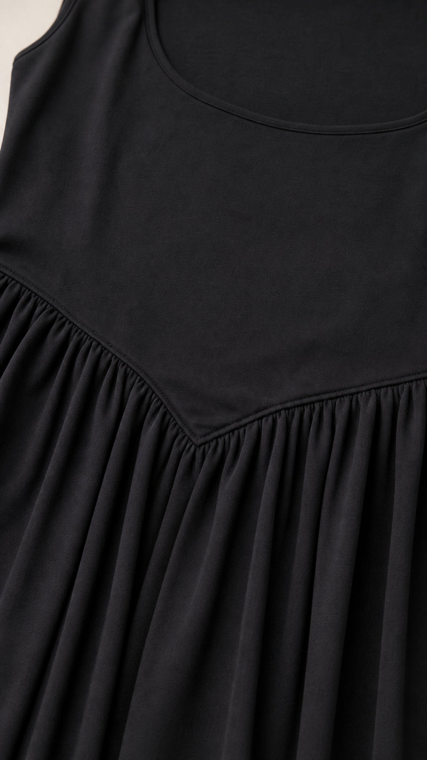 Close-up detail of square neckline and drop-waist seam