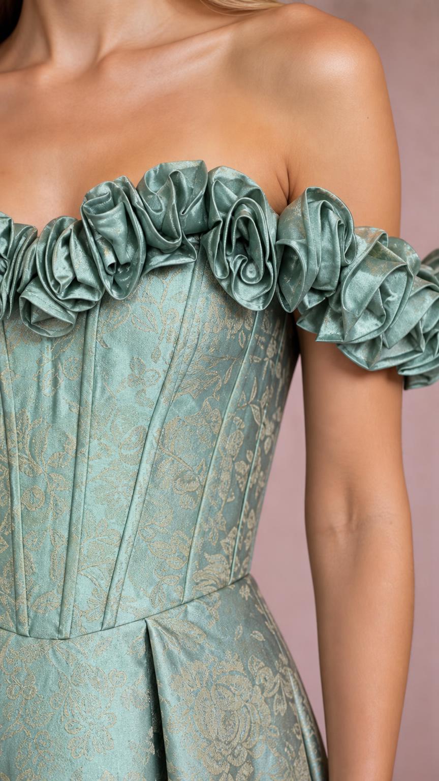 Close-up detail of ruffled neckline and boned bodice on sage green gown