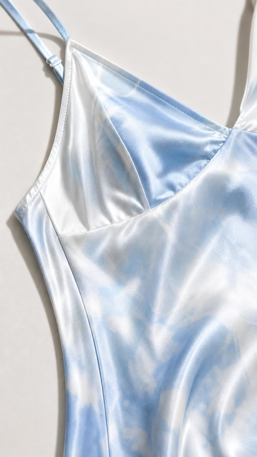 Close up of light blue satin dress neckline and strap detail