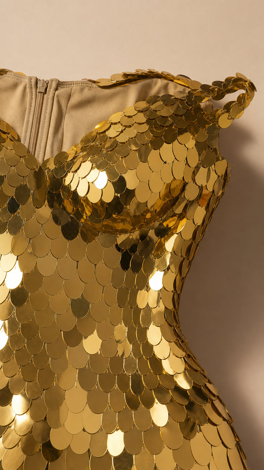 Close-up detail of the bodice and reflective disc sequins