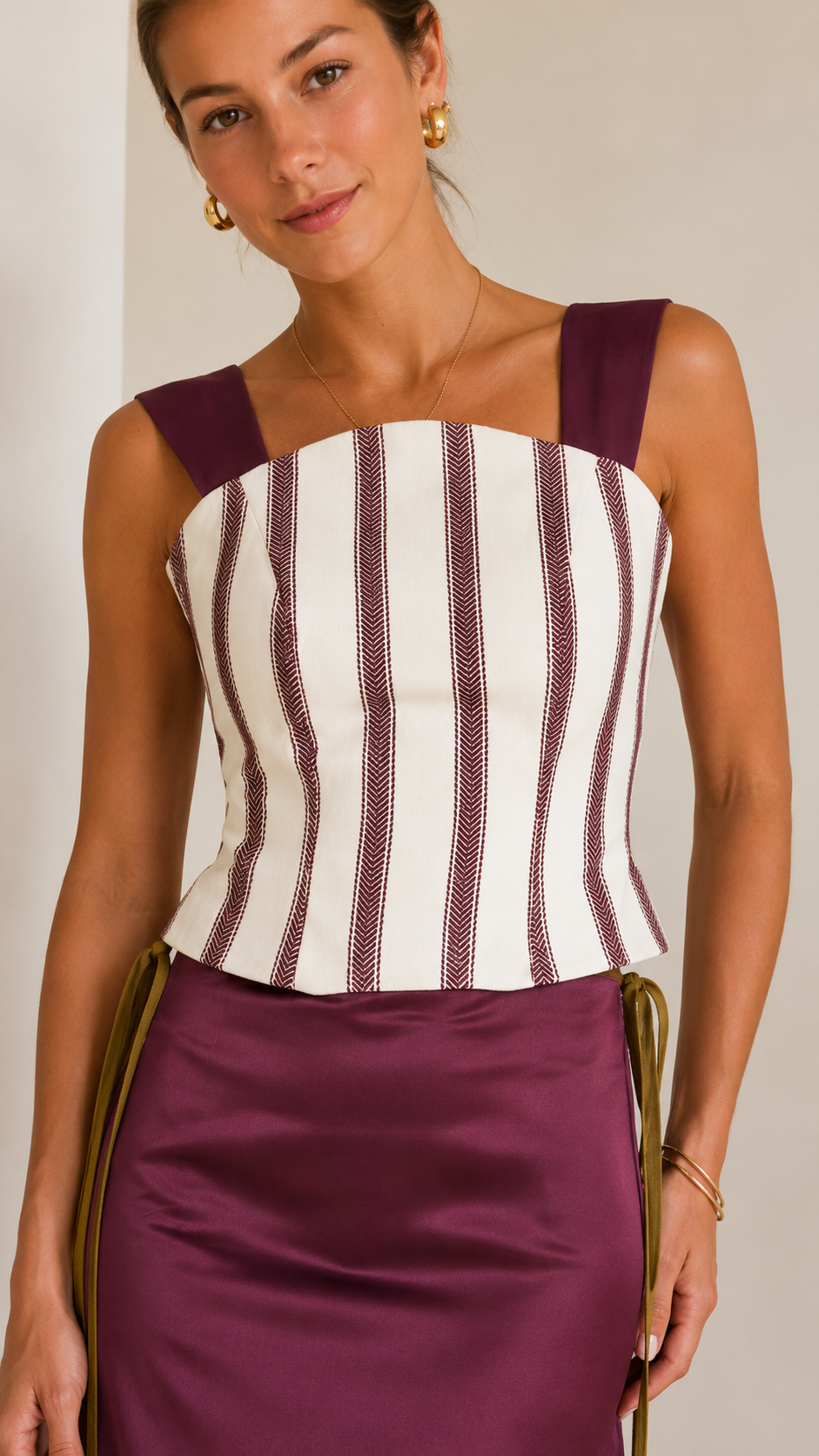 Close-up of striped bodice and square neckline on plum maxi dress