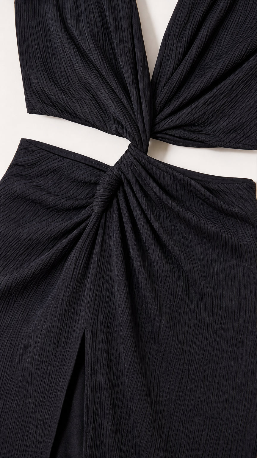 Close-up detail of the center twist knot and cutout on the black dress