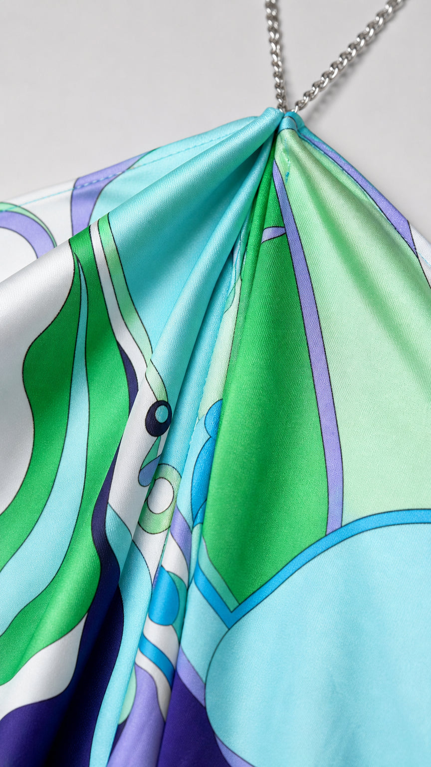 Close-up of fabric texture and chain strap detail