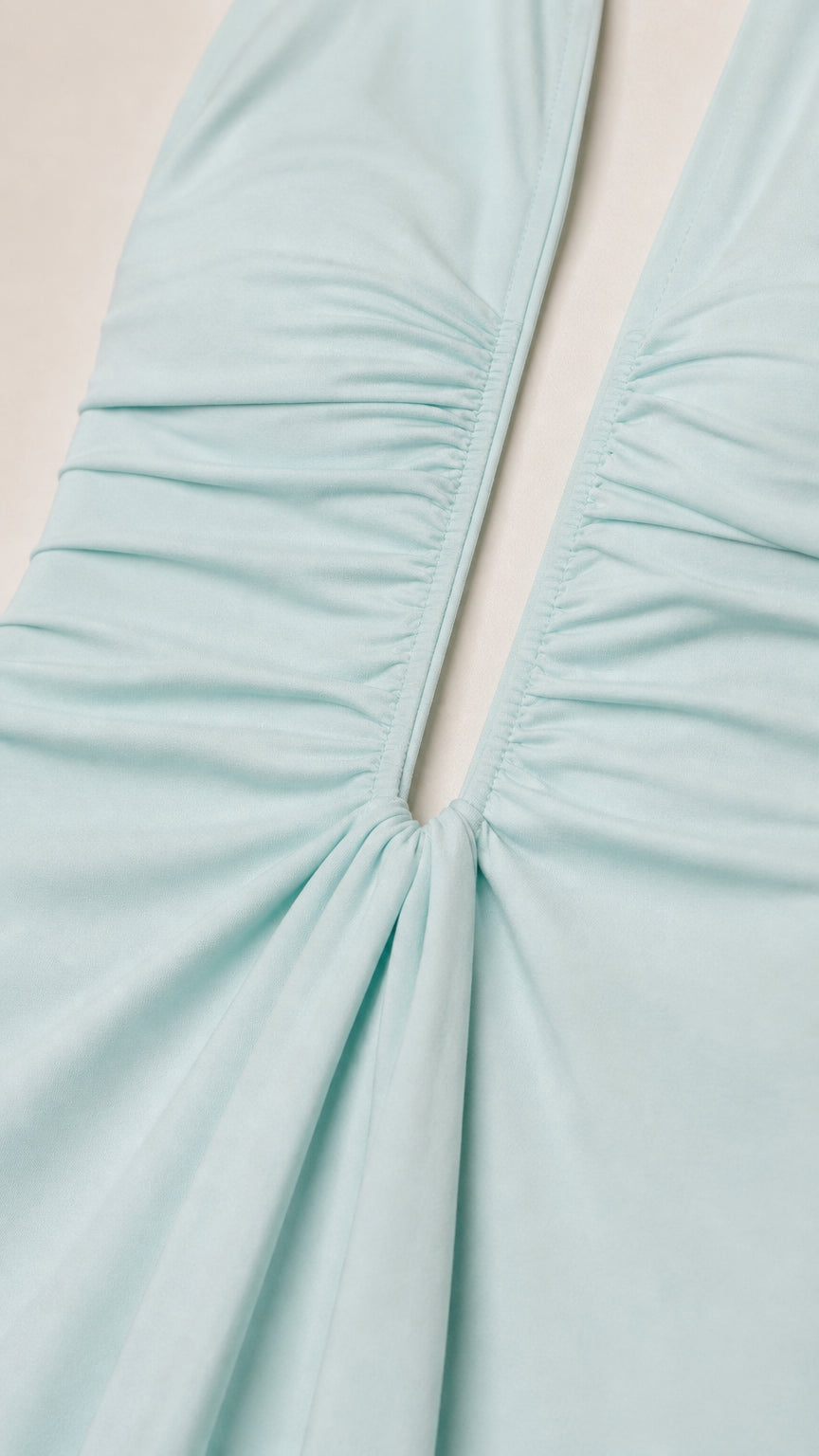 Close-up detail of gathered fabric and neckline