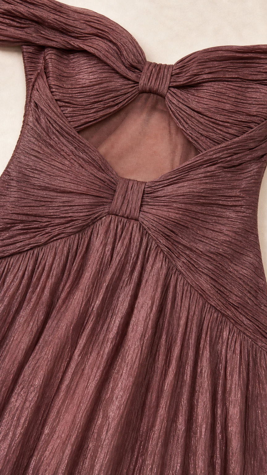 Close-up of textured fabric and bow-accented back cutout