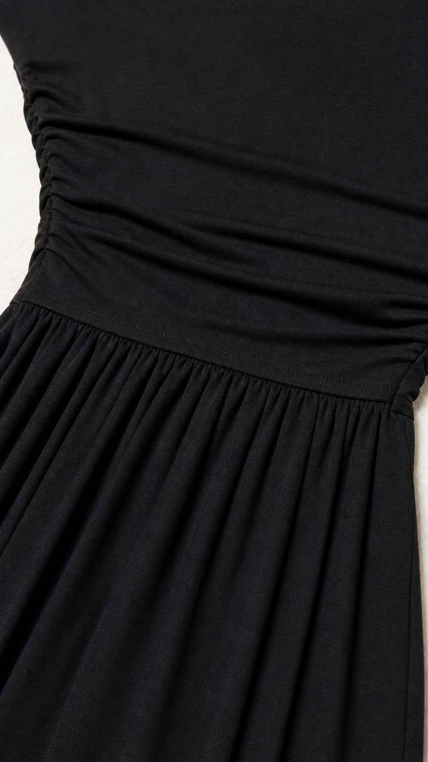 Close up of black dress ruched bodice detail