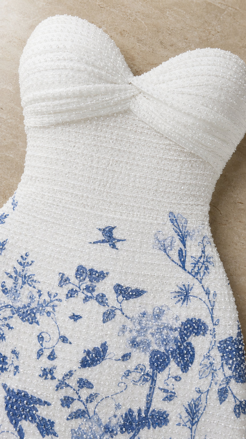 Close-up detail of textured bodice and floral pattern