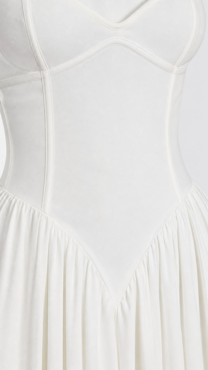 Close-up of structured bodice paneling on white dress
