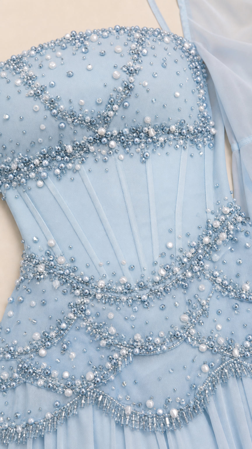 Close-up detail of pearl and bead embellishments on the bodice
