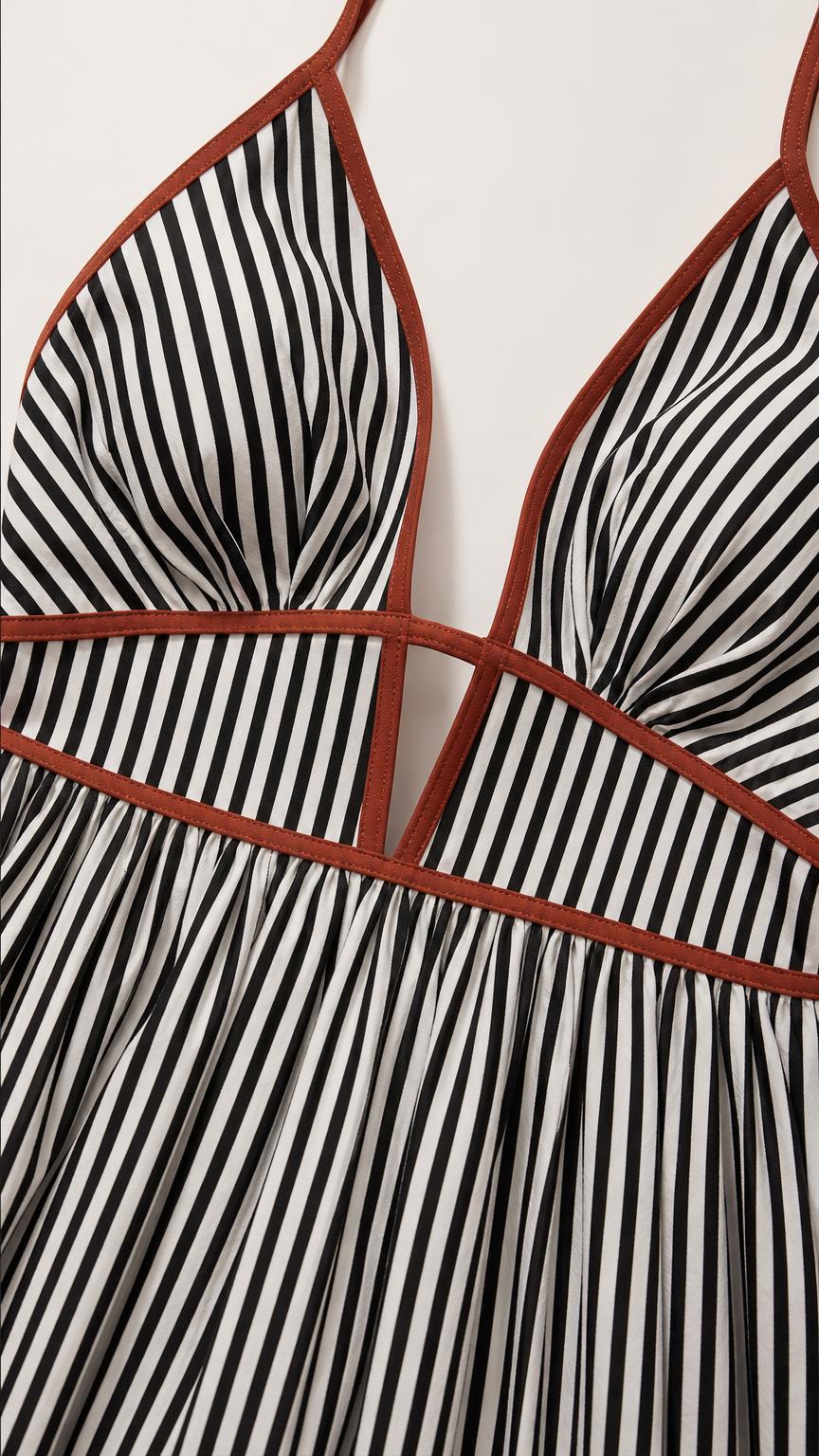 Close-up of V-neckline and contrast piping detail