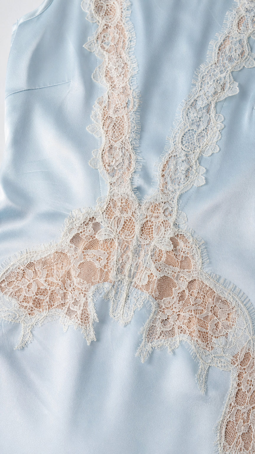 Close-up detail of lace trim on satin bodice
