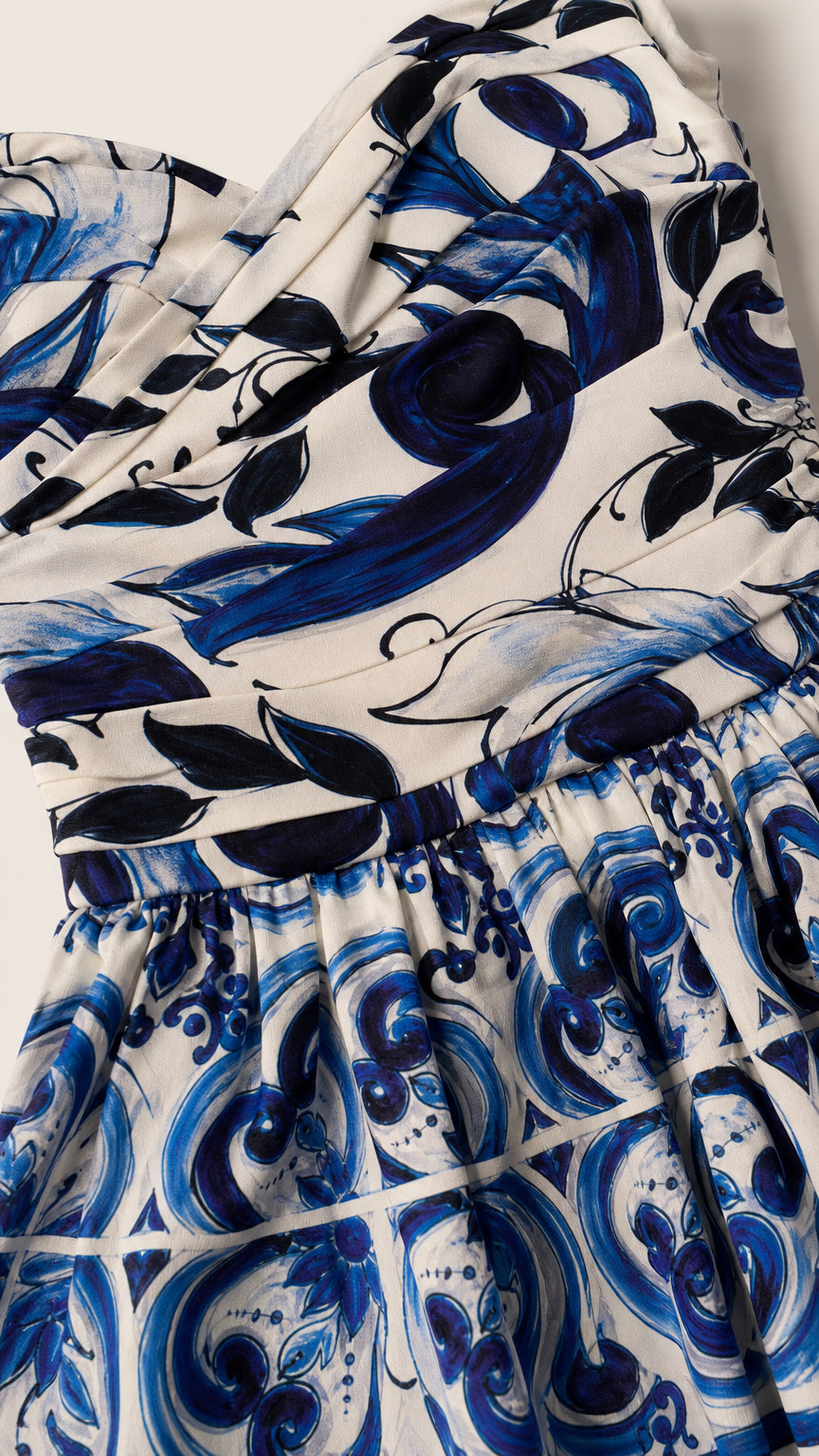Close-up detail of the sweetheart neckline and artisan-inspired print