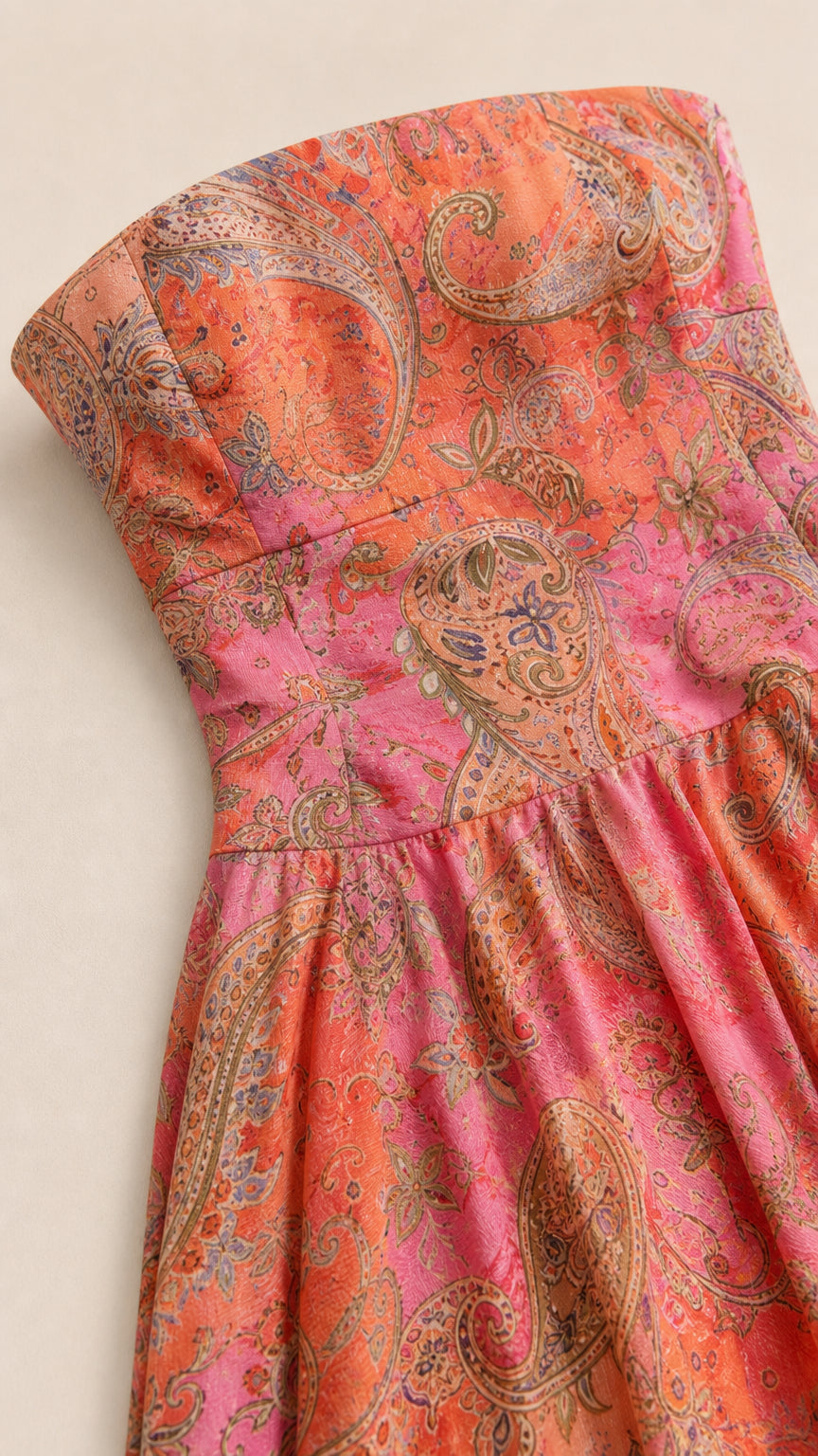 Close-up of pink paisley print fabric and bodice detail