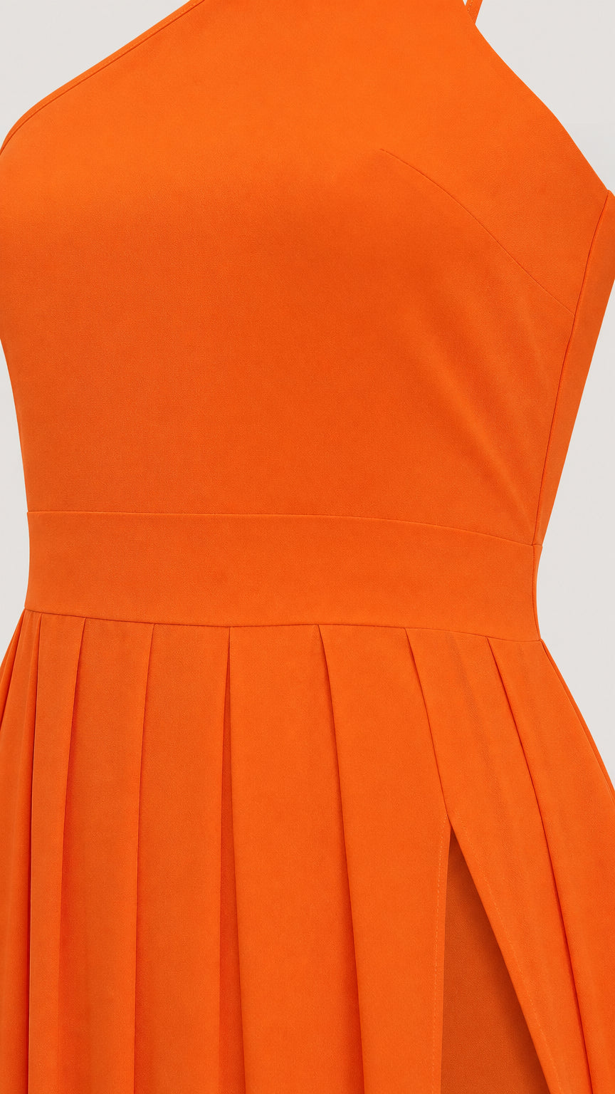 Close-up detail of bodice and pleated waist on orange dress