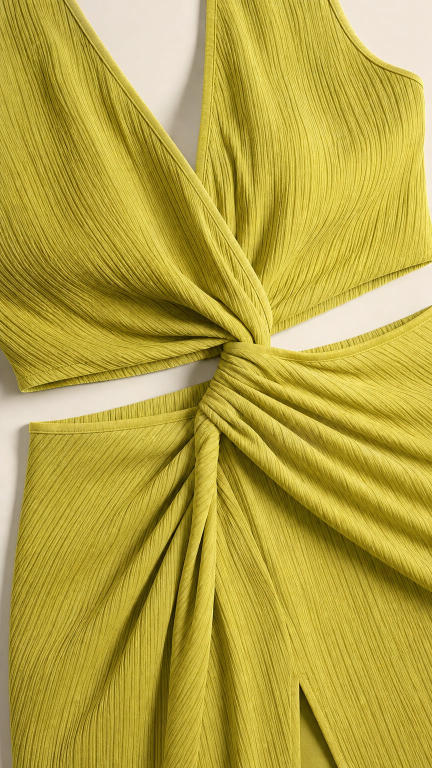 Close-up detail of lime green twist knot and waist cutouts