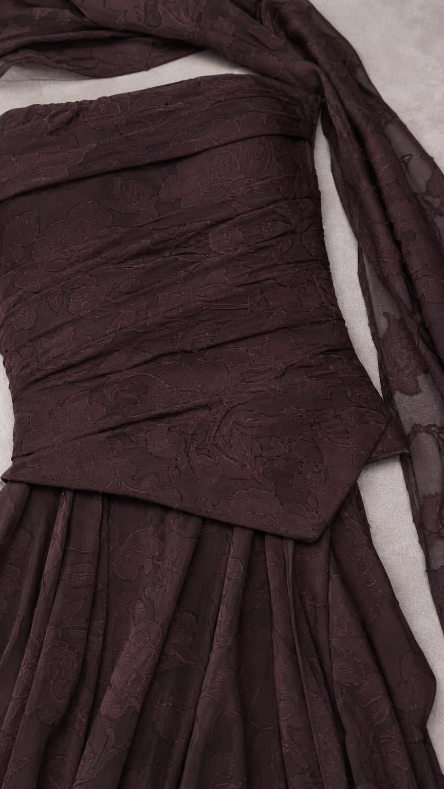 Close-up of textured bodice ruching and asymmetric waist on espresso brown dress