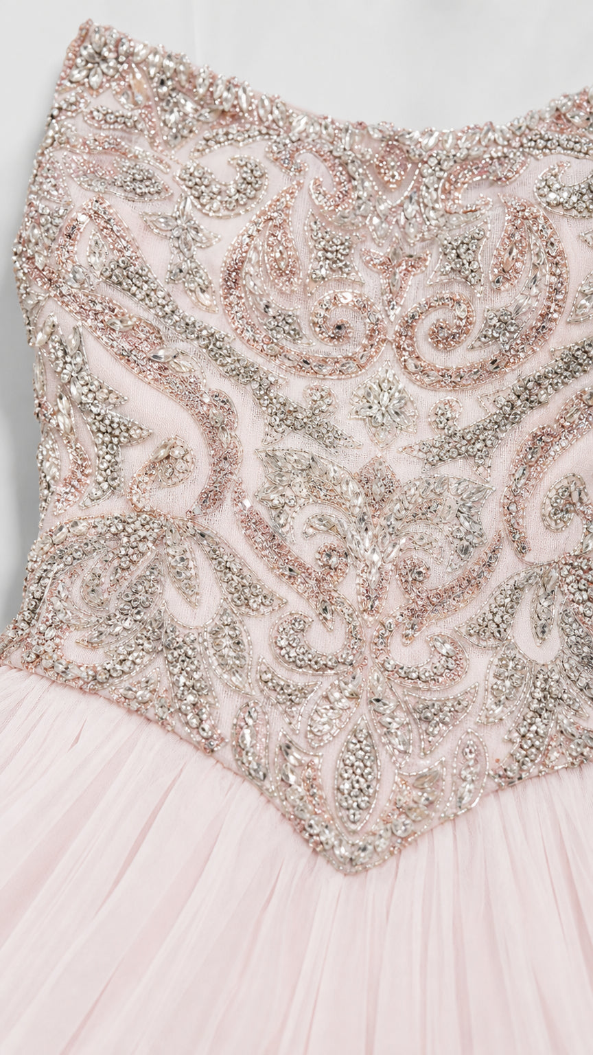Close-up of intricate silver and pink beadwork on the bodice