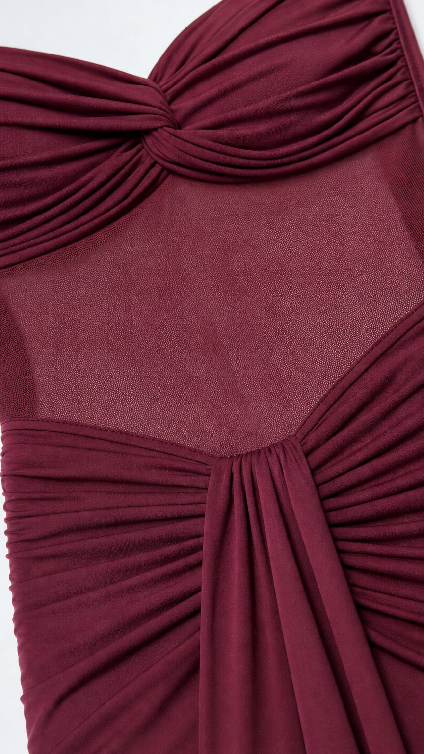 Close-up detail of twist bodice and sheer midsection panel
