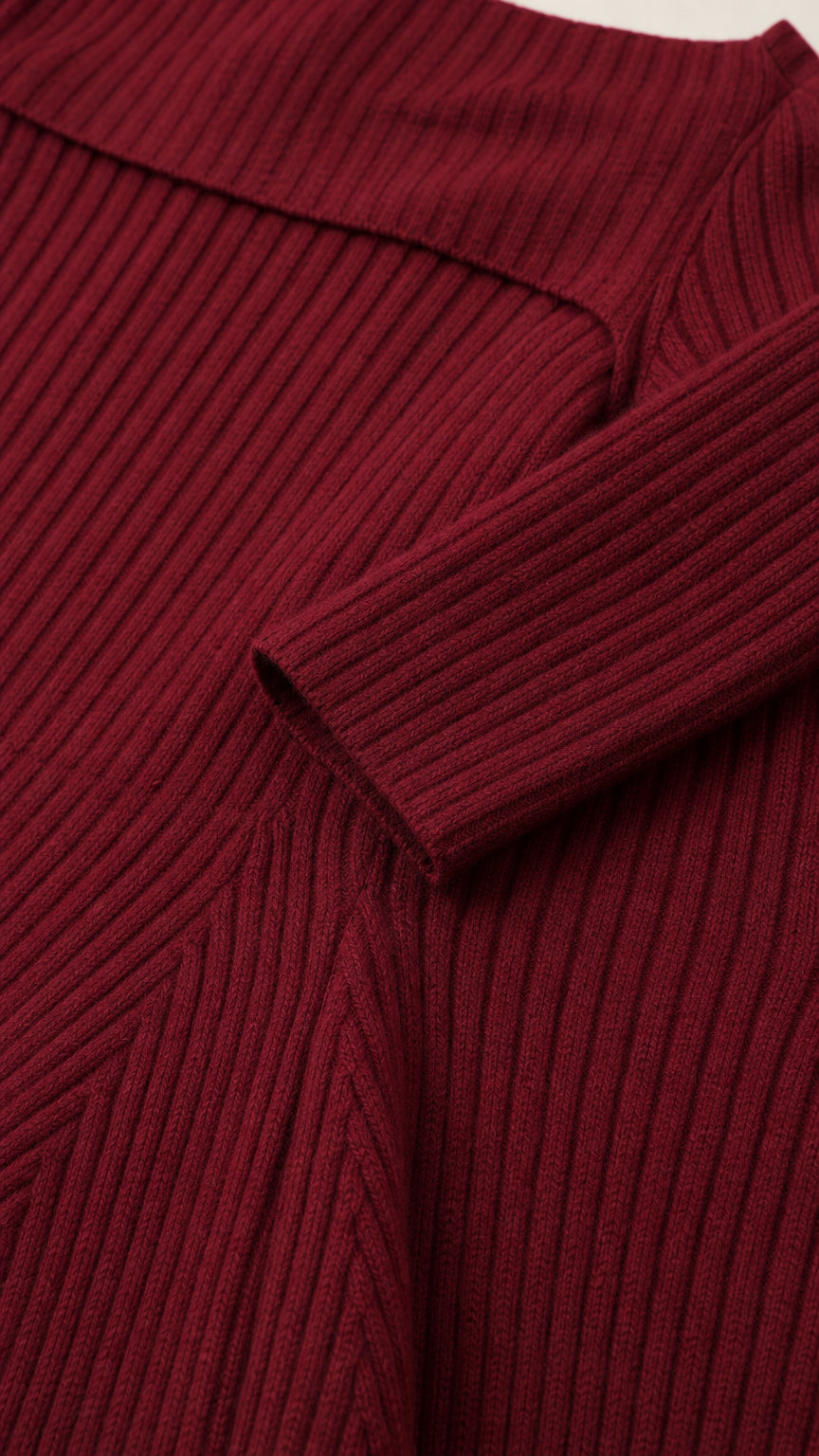 Closeup detail of textured ribbed knit fabric and sleeve cuff