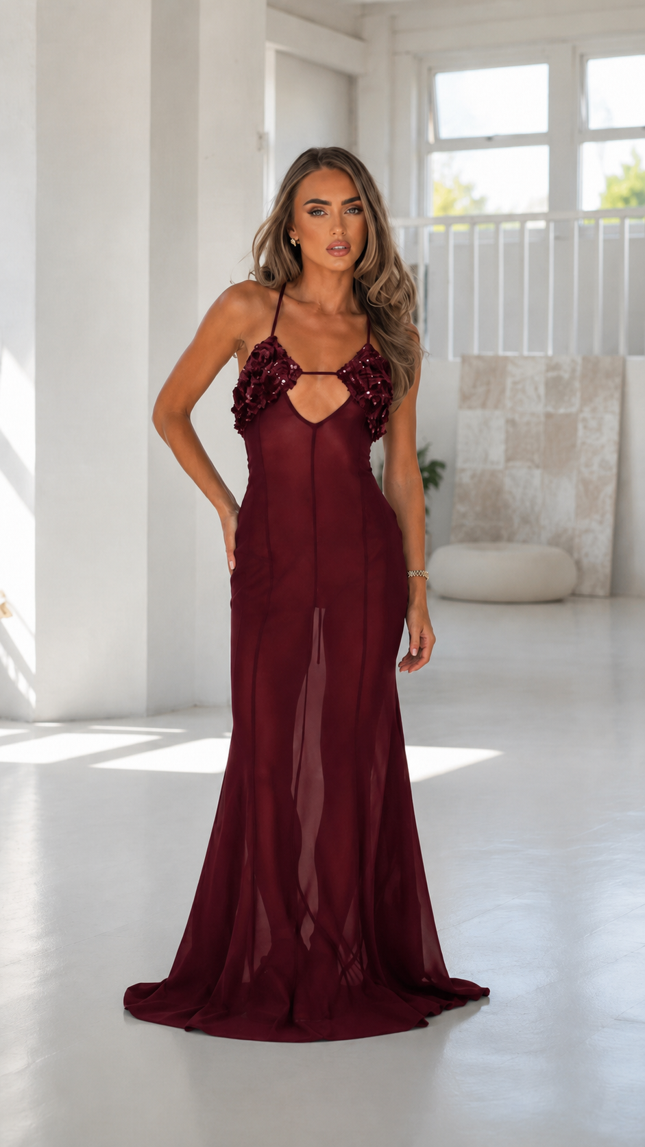 Front view of wine sheer mesh maxi dress with floral appliqué bust