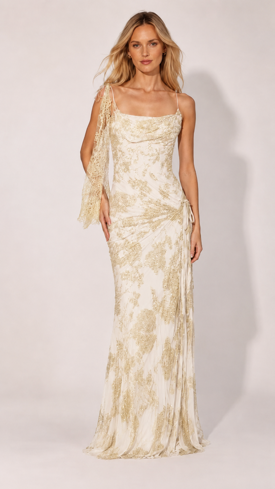 Front view of ivory glitter mesh formal gown with draped neckline and side gathering