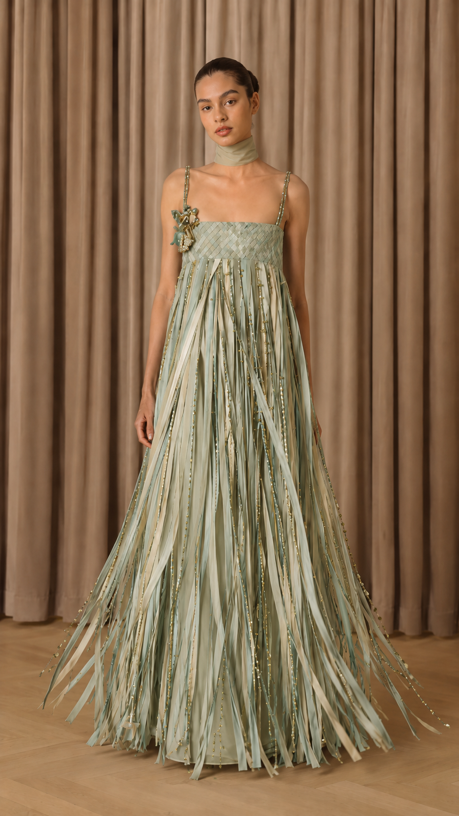 Front view of sage green fringe maxi evening dress with embellished straps and neck scarf